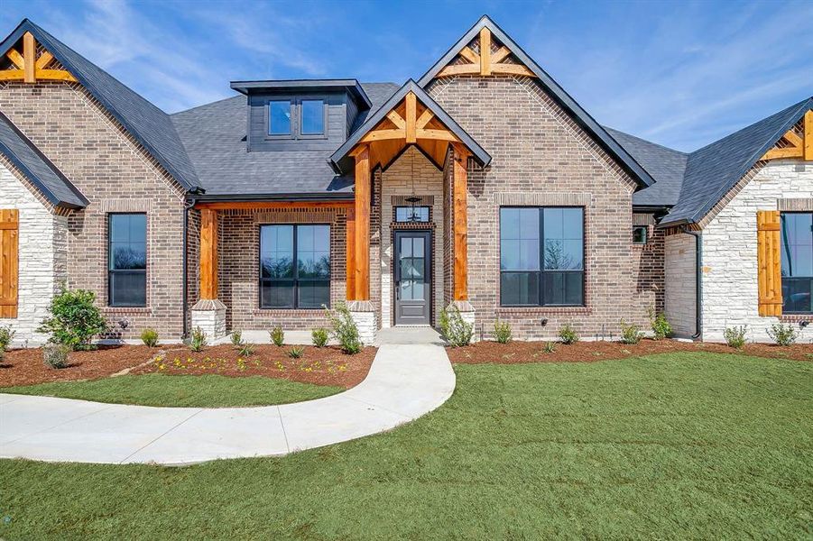 Front exterior of a new home in Waterfall Ranch Estates, Waxahachie, TX, highlighting curb appeal (Image 26).
