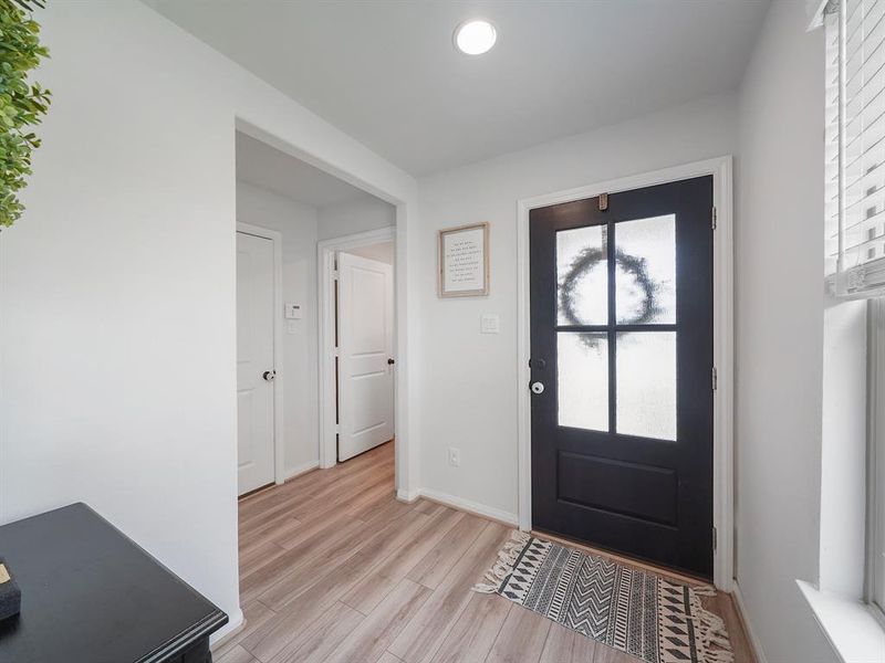 A look from inside the front door peaking into the utility room.