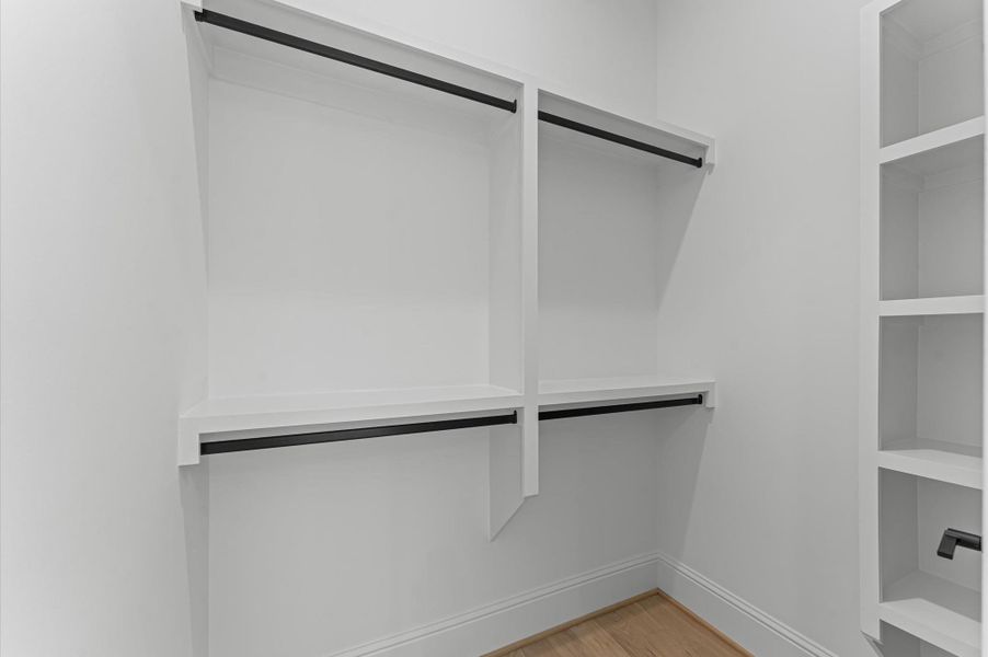 Walk-in closet for secondary bedroom.
