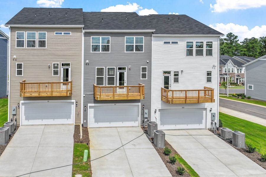 Front exterior of a new home in Renaissance at White Oak, Garner, NC, highlighting curb appeal (Image 24). Front exterior of a new home in Renaissance at White Oak, Garner, NC, highlighting curb appeal (Image 24).