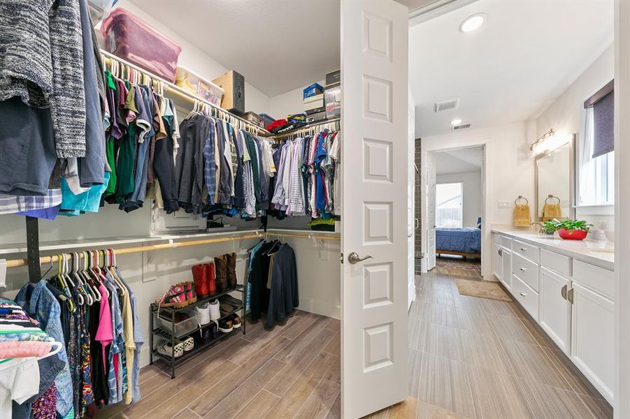 Generous walk-in closet offers plenty of storage and organization.