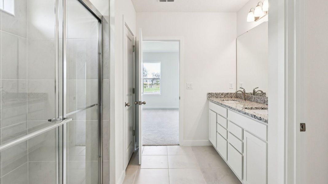 Baker Floor Plan Primary Suite Bathroom by DRB Homes Baker Floor Plan Primary Suite Bathroom by DRB Homes