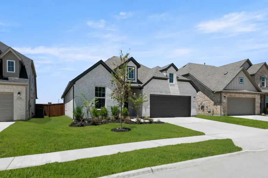 Representative exterior photo of a completed home built from the Valor by Rockwell Homes in Wildflower Ranch, Justin, TX (Image 2).