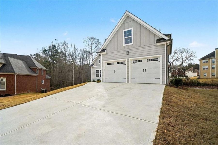 Front exterior of a new home in , Douglasville, GA, highlighting curb appeal (Image 2). Front exterior of a new home in , Douglasville, GA, highlighting curb appeal (Image 2).