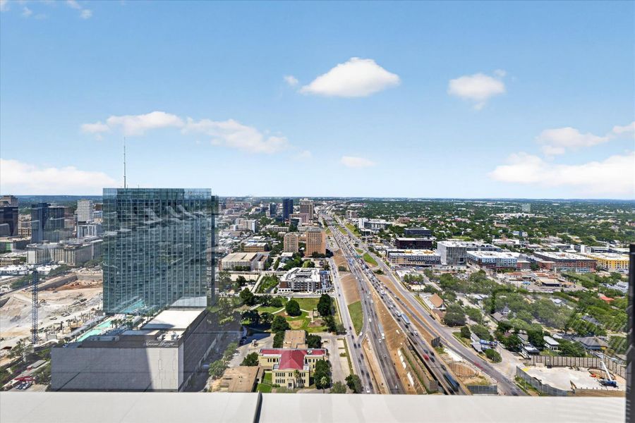 Panoramic city views extend for miles, encompassing both urban development and natural landscapes.