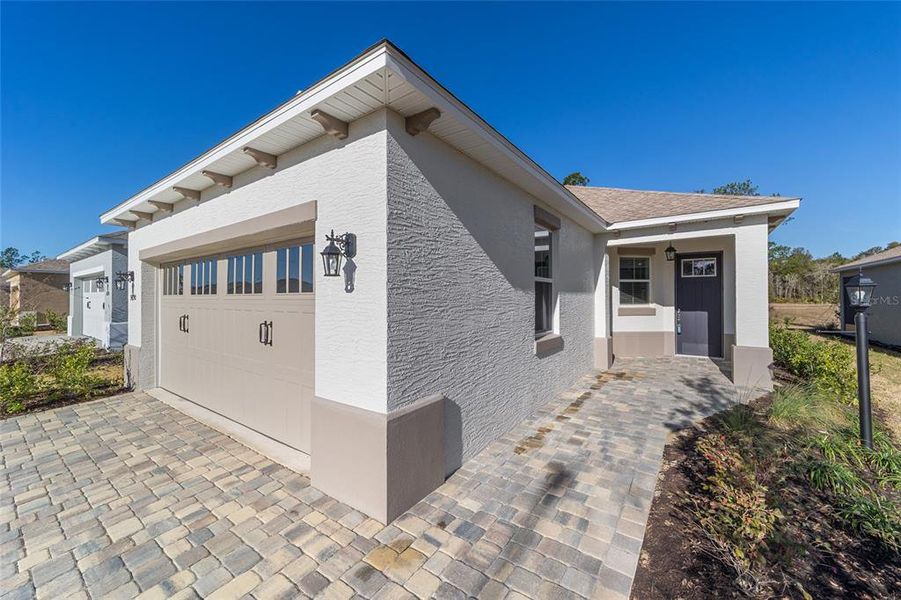 Exterior details and patio area of a home in On Top of the World Communities, Ocala (Image 23).