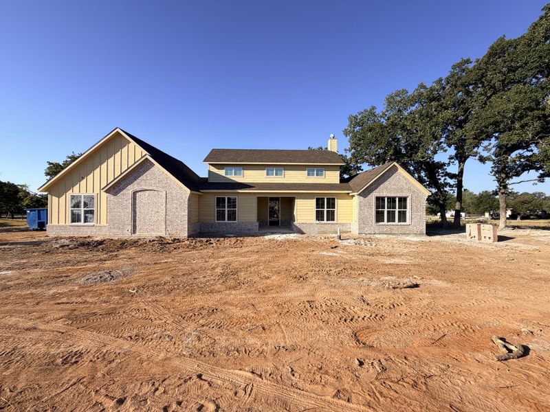 Front exterior of a new home in Monarch Manor, Poolville, TX, highlighting curb appeal (Image 10).