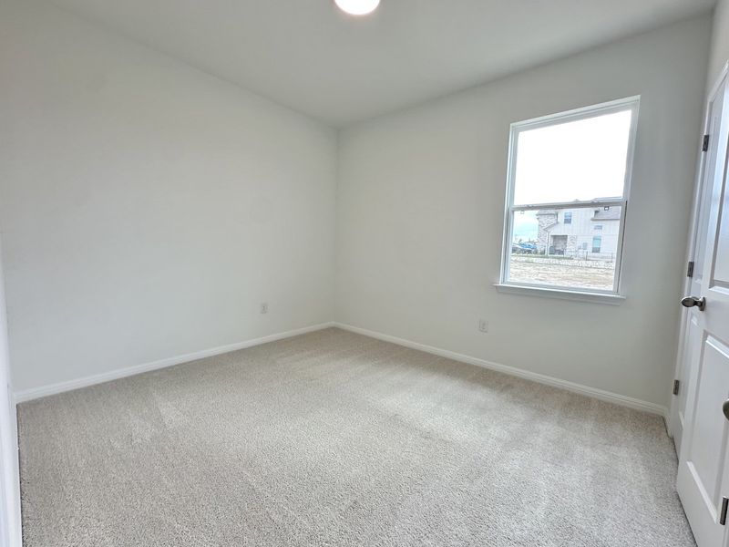 Spacious, unfurnished interior of a new home in Crosswinds, Kyle (Image 10).