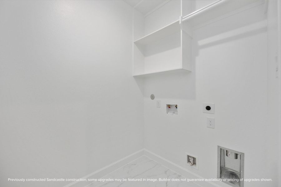 Located on the second floor, the laundry room offers convenience with space for side-by-side washer and dryer, complemented by hang and shelf space and an additional closed (not pictured) Located on the second floor, the laundry room offers convenience with space for side-by-side washer and dryer, complemented by hang and shelf space and an additional closed (not pictured)