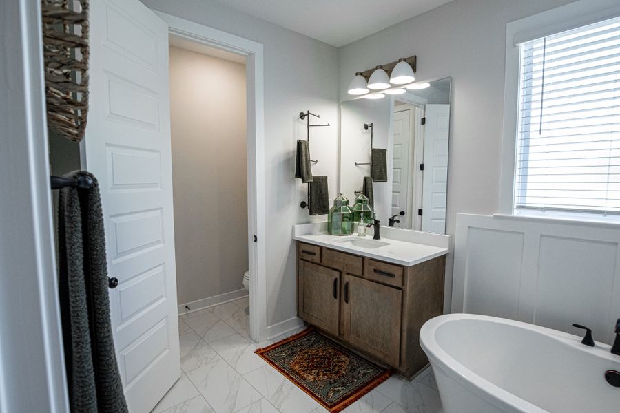 Representative furnished interior of a home built from the Willow by Grant & Co in Manor at Hall Creek, Arlington (Image 125).