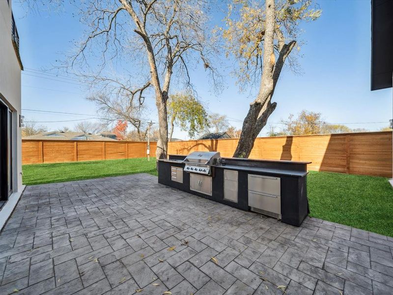 View of patio / terrace featuring area for grilling and exterior kitchen