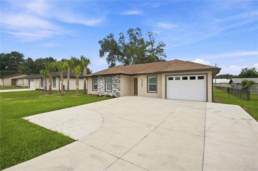 Front exterior of a new home in , Ocala, FL, highlighting curb appeal (Image 20).