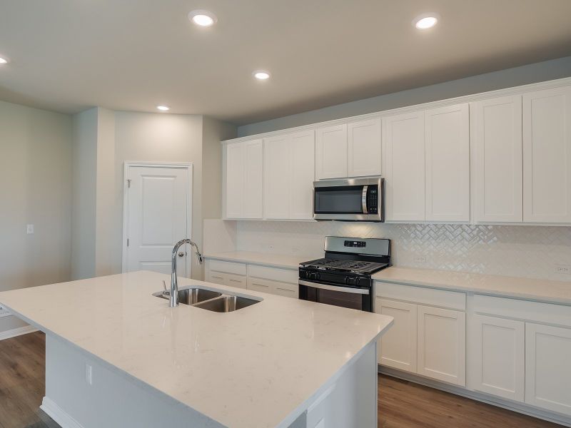 Furnished interior view inside a new home in Turner's Crossing - Reserve Collection, Buda (Image 3).