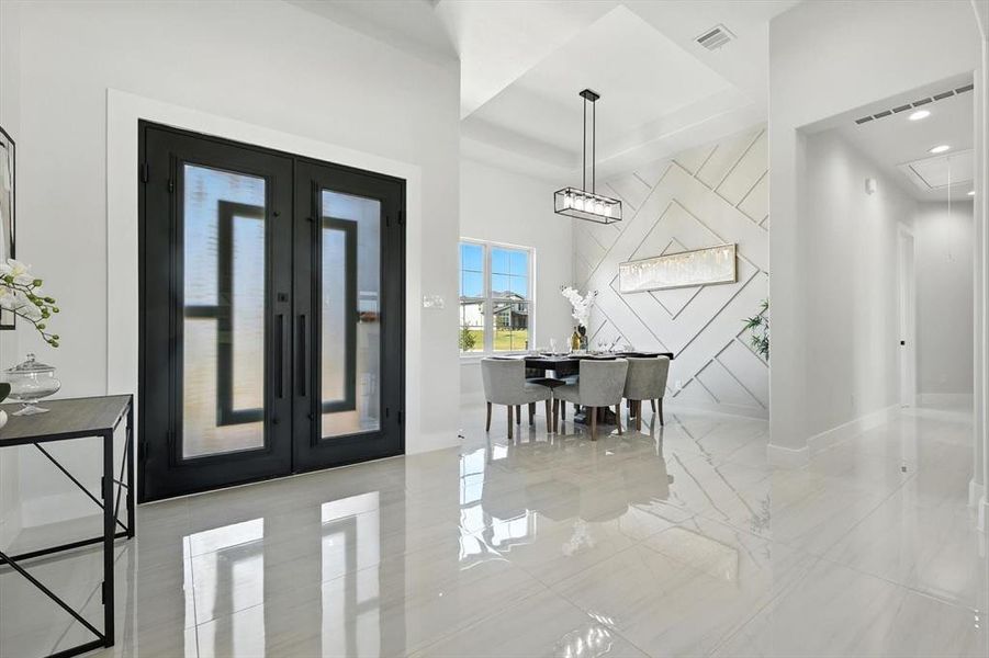 Foyer entrance featuring french doors and baseboards Foyer entrance featuring french doors and baseboards