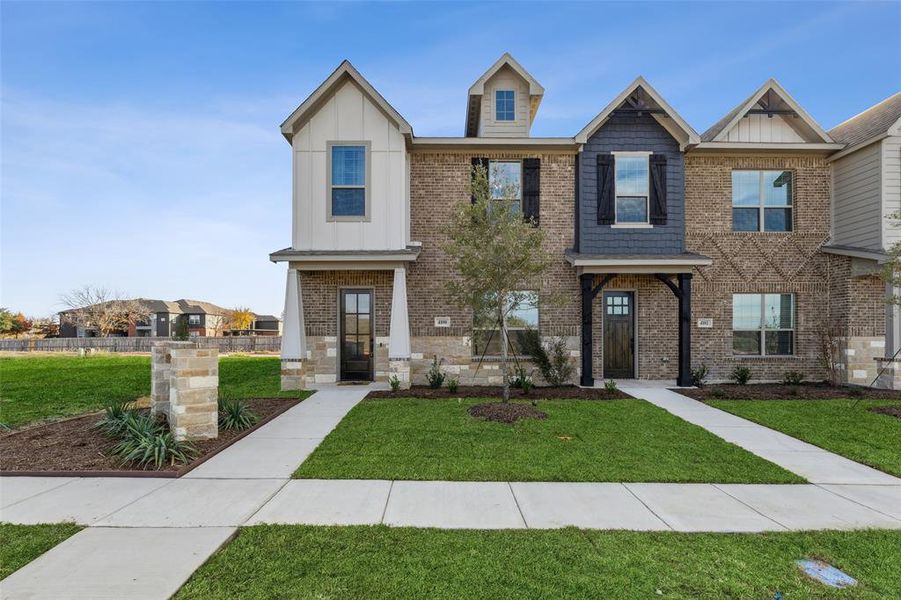 View of front of property with a front lawn