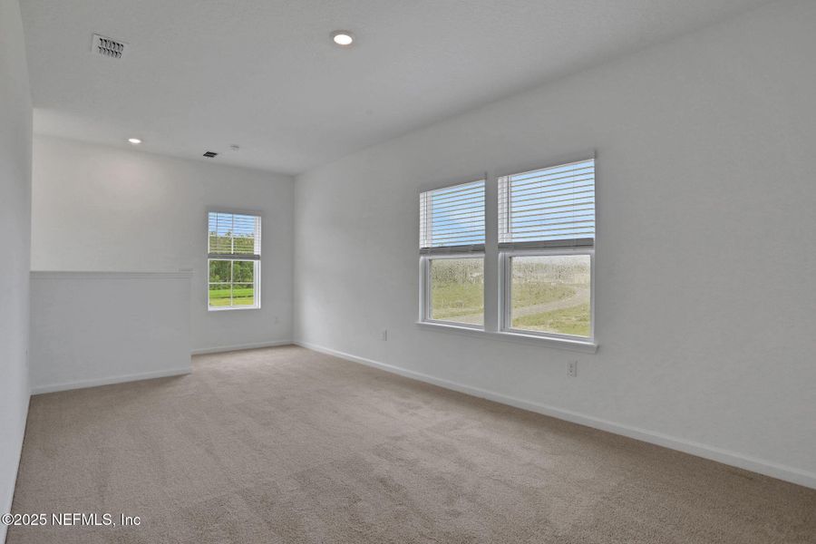 Spacious, unfurnished interior of a new home in TrailMark, St. Augustine (Image 32).