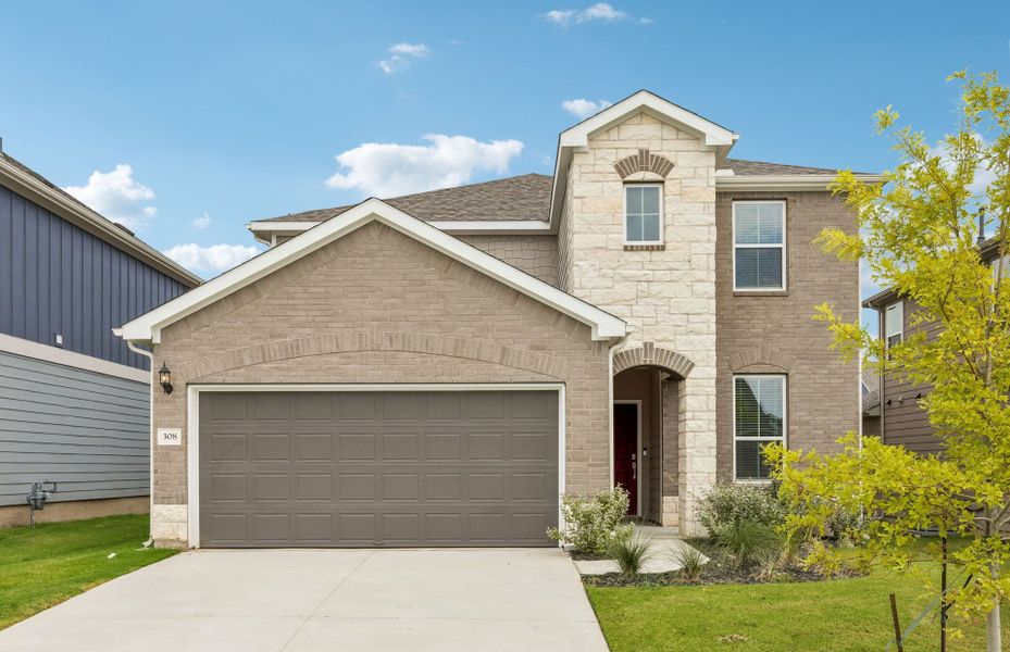 Front exterior of a new home in Patterson Ranch, Georgetown, TX, highlighting curb appeal (Image 18). Front exterior of a new home in Patterson Ranch, Georgetown, TX, highlighting curb appeal (Image 18).
