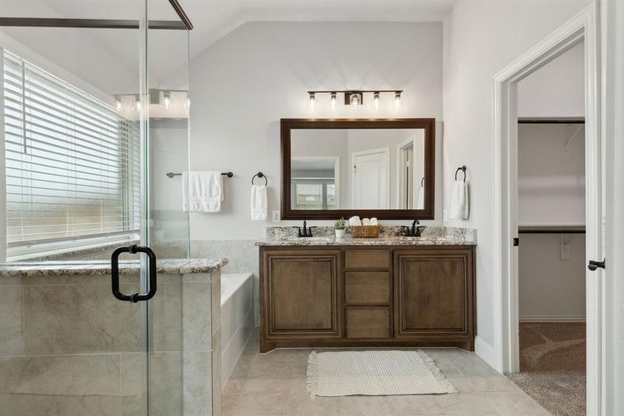 Primary bathroom includes duel sinks, garden tub and shower.