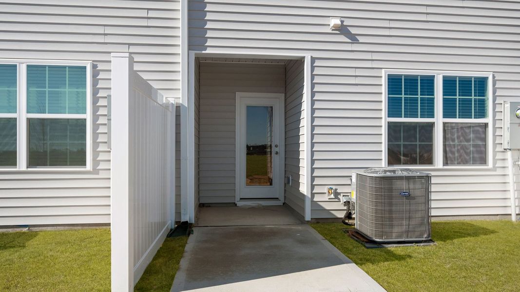 Exterior details and patio area of a home in The Townes at Ridgewood Farms, Winterville (Image 21).
