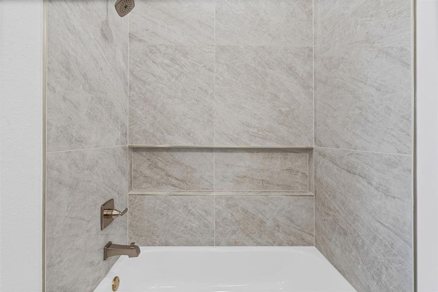 Bathroom view of shower / washtub combination Bathroom view of shower / washtub combination