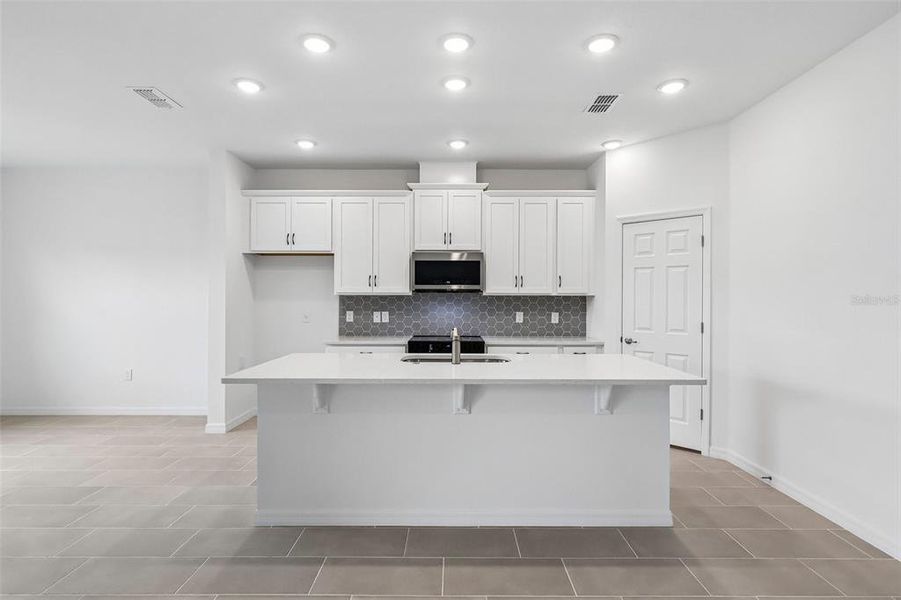Furnished interior view inside a new home in Trinity Place, St. Cloud (Image 5).