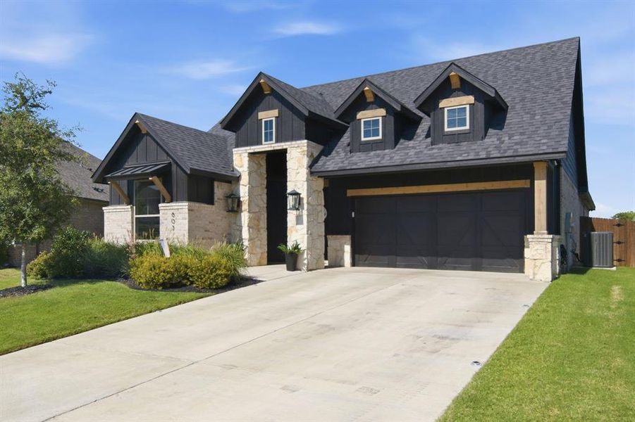 Front exterior of a new home in , Burleson, TX, highlighting curb appeal (Image 20).
