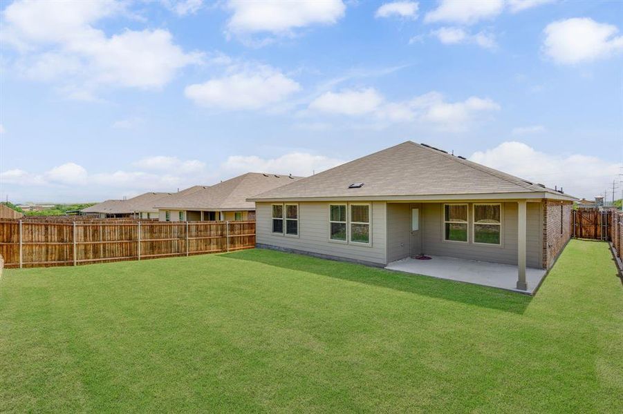 Front exterior of a new home in Cambridge Brook, Denton, TX, highlighting curb appeal (Image 22). Front exterior of a new home in Cambridge Brook, Denton, TX, highlighting curb appeal (Image 22).