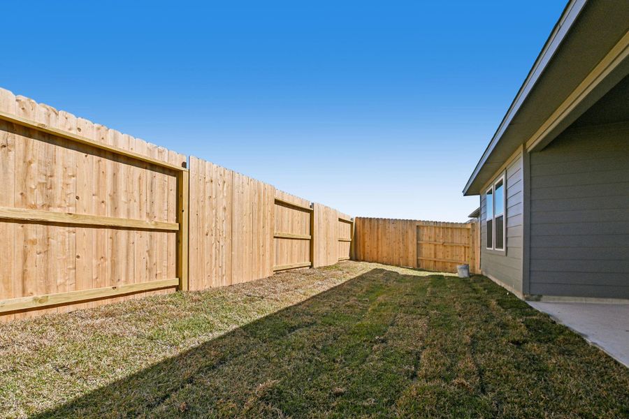 Exterior details and patio area of a home in Granger Pointe - Traditional Series, Conroe (Image 21).