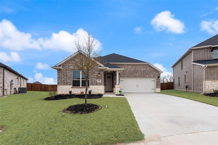 Front exterior of a new home in Walden Pond, Forney, TX, highlighting curb appeal (Image 1). Front exterior of a new home in Walden Pond, Forney, TX, highlighting curb appeal (Image 1).