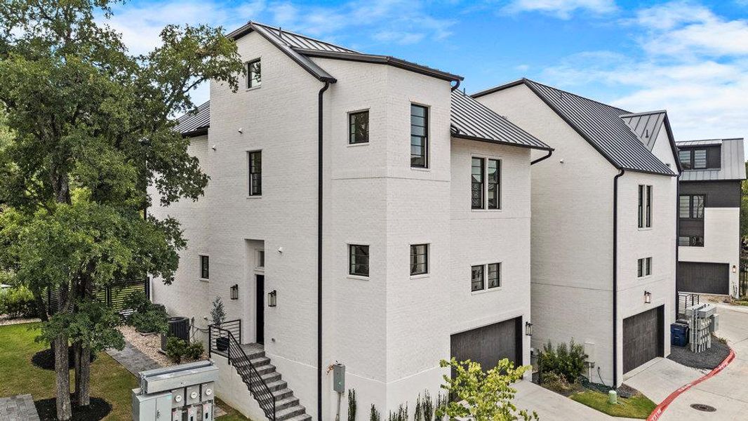 Front exterior of a new home in Spyglass, Austin, TX, highlighting curb appeal (Image 22). Front exterior of a new home in Spyglass, Austin, TX, highlighting curb appeal (Image 22).
