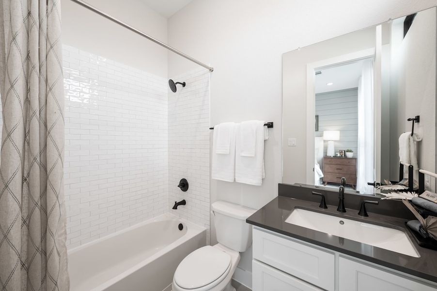 Representative furnished interior of a home built from the Carignan by Tri Pointe Homes in Woodson’s Reserve, Spring (Image 65).