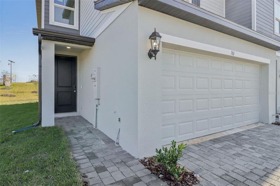 Exterior details and patio area of a home in The Reserve at Hammock Oaks Townes, Lady Lake (Image 4). Exterior details and patio area of a home in The Reserve at Hammock Oaks Townes, Lady Lake (Image 4).