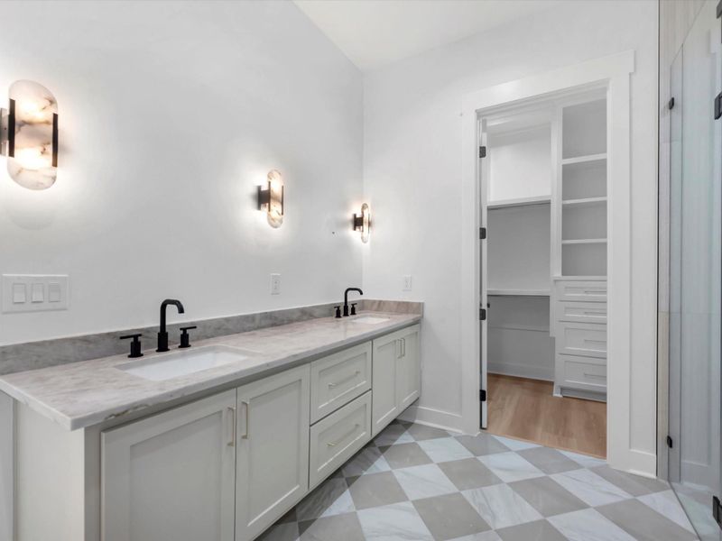 Primary bathroom, featuring free standing tub, and oversized stand up shower. You will also notice separated his and hers closets.