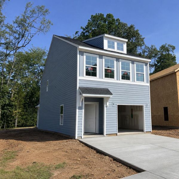 Front exterior of a new home in , Goose Creek, SC, highlighting curb appeal (Image 1). Front exterior of a new home in , Goose Creek, SC, highlighting curb appeal (Image 1).