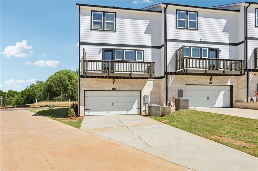 Front exterior of a new home in Hemingway - Highland Series, Cumming, GA, highlighting curb appeal (Image 23).