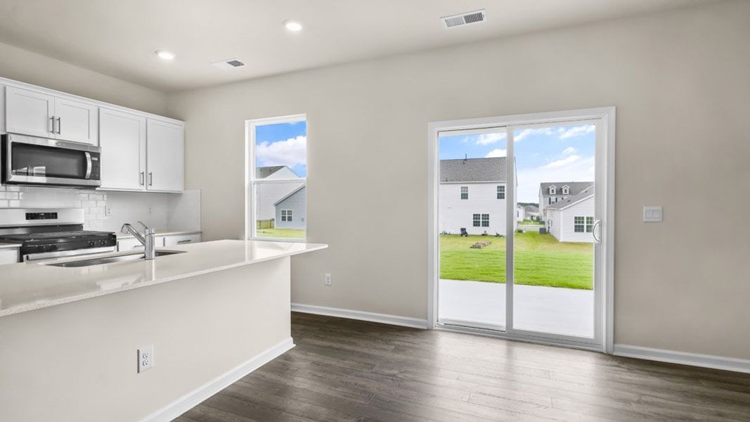 Representative furnished interior of a home built from the BELHAVEN by D.R. Horton in Galvins Ridge, Sanford (Image 5).