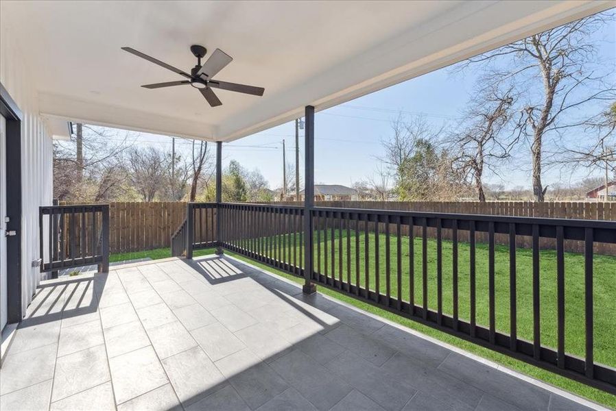 Unfurnished sunroom with a ceiling fan