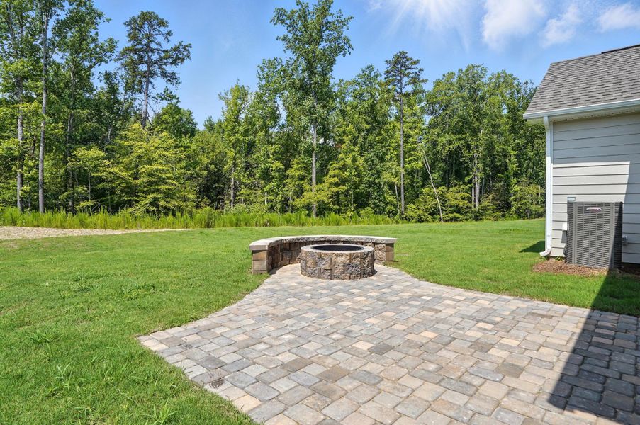 Front exterior of a new home in Heritage - 55+ Community, Wesley Chapel, NC, highlighting curb appeal (Image 24).
