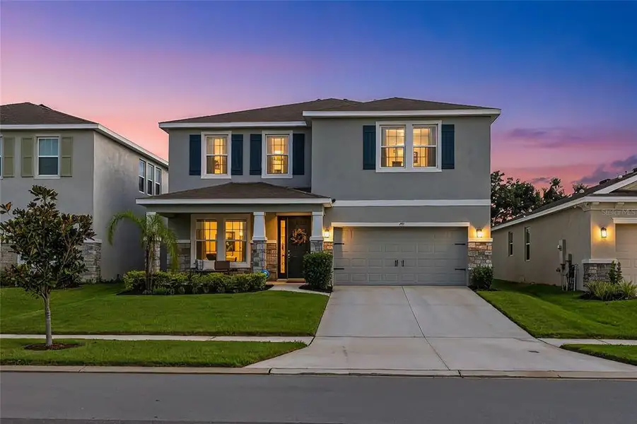 Front exterior of a new home in , Apollo Beach, FL, highlighting curb appeal (Image 20).