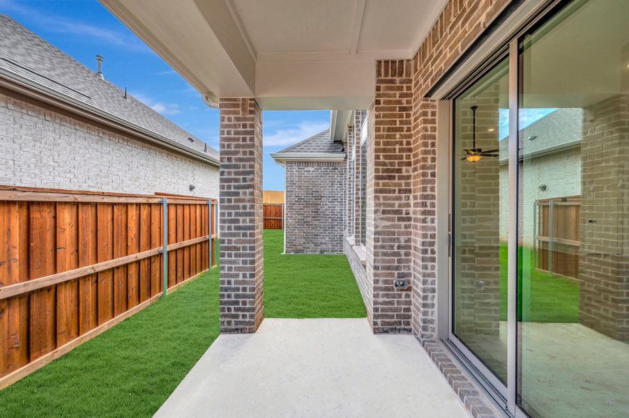 Exterior details and patio area of a home in Elements at Viridian - Garden Series, Arlington (Image 3). Exterior details and patio area of a home in Elements at Viridian - Garden Series, Arlington (Image 3).
