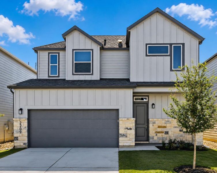 Modern façade with mixed materials and contemporary window designs creates compelling curb appeal. Modern façade with mixed materials and contemporary window designs creates compelling curb appeal.