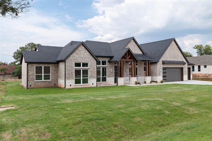 Front exterior of a new home in Pecan Plantation, Granbury, TX, highlighting curb appeal (Image 26). Front exterior of a new home in Pecan Plantation, Granbury, TX, highlighting curb appeal (Image 26).