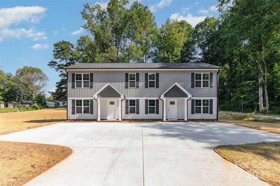 Front exterior of a new home in , Kannapolis, NC, highlighting curb appeal (Image 14).