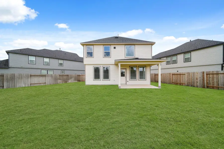 Front exterior of a new home in Grand Oaks Village, Houston, TX, highlighting curb appeal (Image 2). Front exterior of a new home in Grand Oaks Village, Houston, TX, highlighting curb appeal (Image 2).