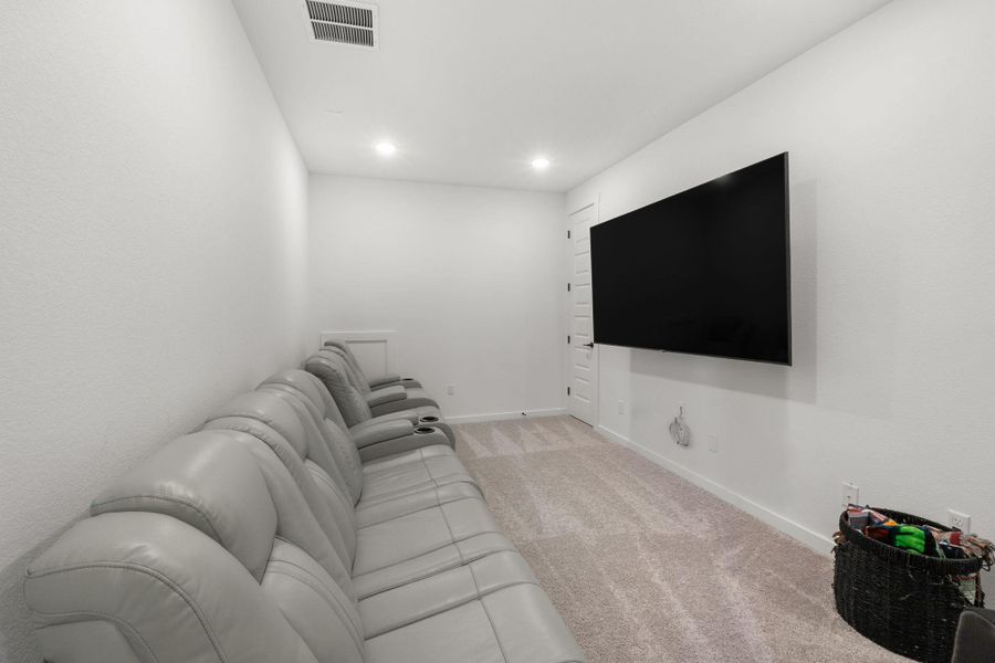 This theatre space is perfect for movie nights, gaming, or relaxing with your favorite shows.