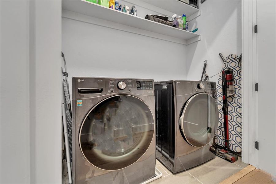 Laundry area on 3rd floor featuring tile patterned floors and washer and dryer Laundry area on 3rd floor featuring tile patterned floors and washer and dryer