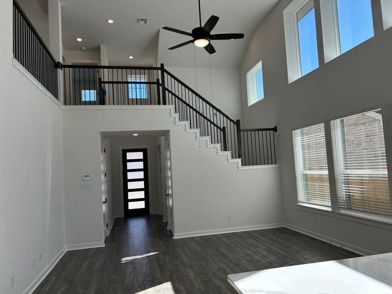 Entrance foyer featuring recessed lighting, dark wood-style flooring, a high ceiling, healthy amount of natural light, and ceiling fan Entrance foyer featuring recessed lighting, dark wood-style flooring, a high ceiling, healthy amount of natural light, and ceiling fan