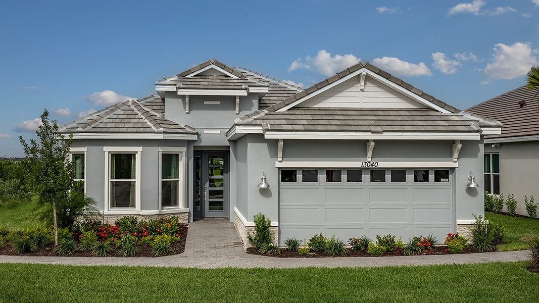 Representative exterior photo of a completed home built from the Farnese by Taylor Morrison in Astor Creek Golf and Country Club, Port St. Lucie, FL (Image 23).