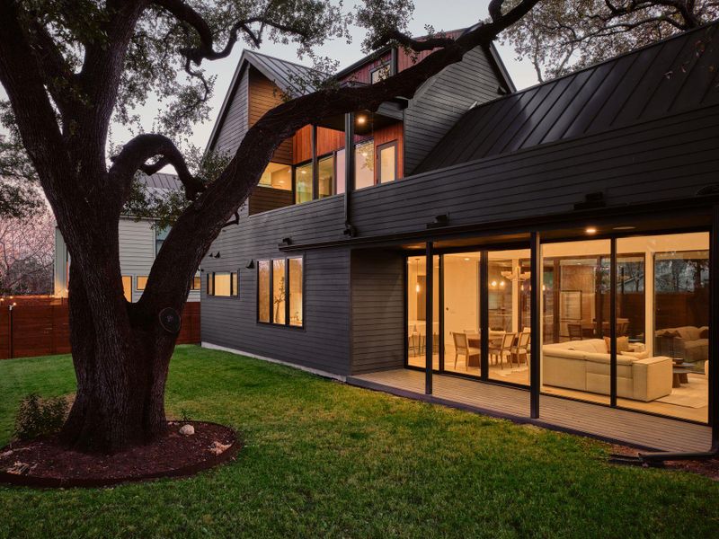 Rear view of property with a standing seam roof and a balcony