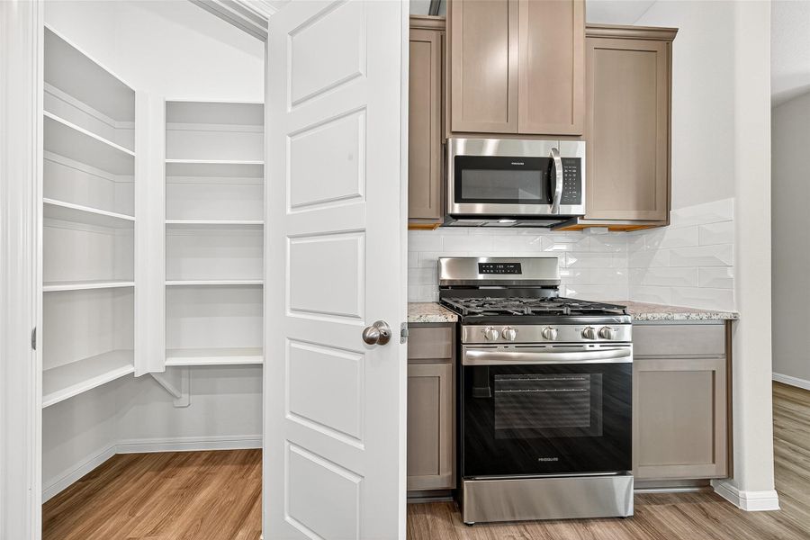 Furnished interior view inside a new home in Sunterra, Katy (Image 18).